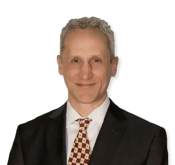 Business professional in suit and tie at a blueprint development session.